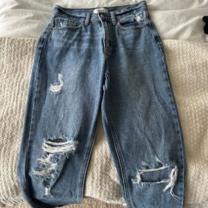Ripped medium wash straight leg jeans
